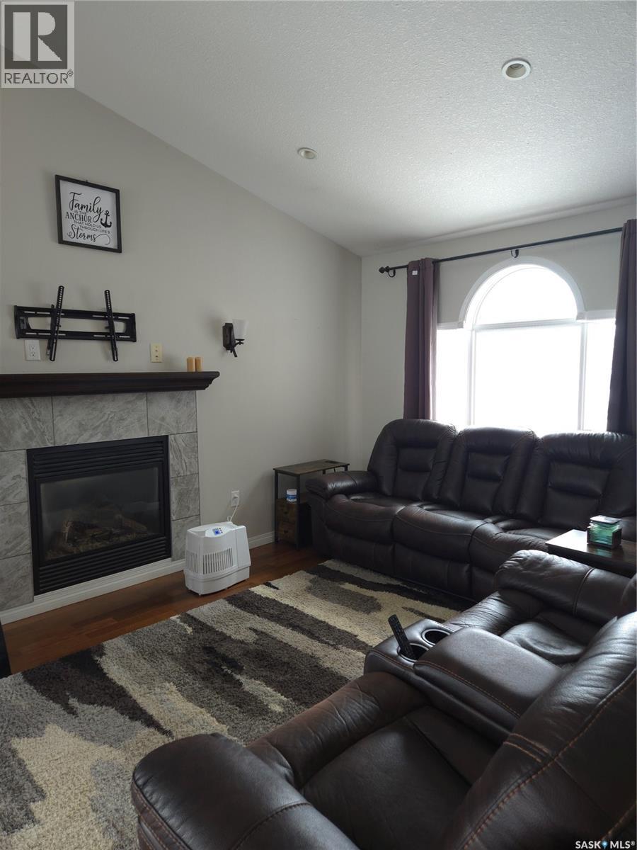 8 Main Bay, Muenster, SK - Indoor Photo Showing Living Room With Fireplace