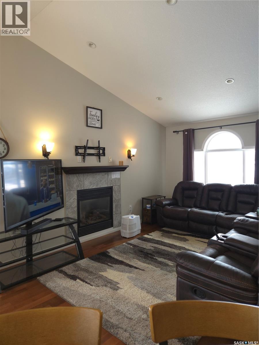 8 Main Bay, Muenster, SK - Indoor Photo Showing Living Room With Fireplace