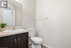 Bathroom featuring vanity and toilet -