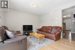 Living room with wood finished floors and stairs -