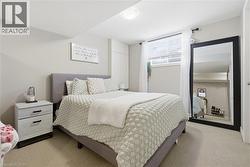 Bedroom featuring light colored carpet -