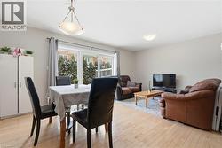 Dining area with light wood-style flooring -