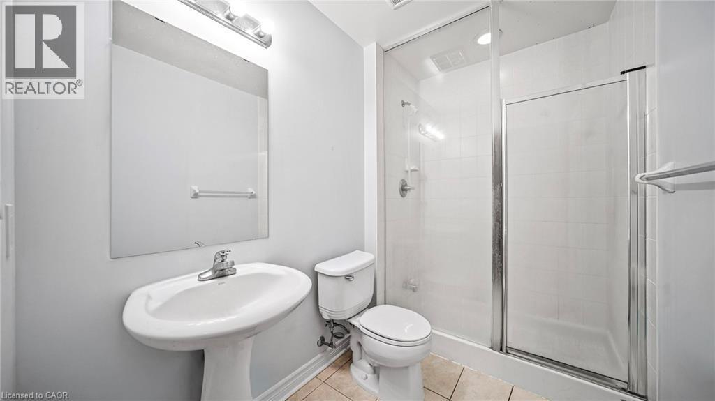 Bathroom featuring tile patterned floors and a stall shower - 388 Prince Of Wales Drive Unit# 1609, Mississauga, ON - Indoor Photo Showing Bathroom