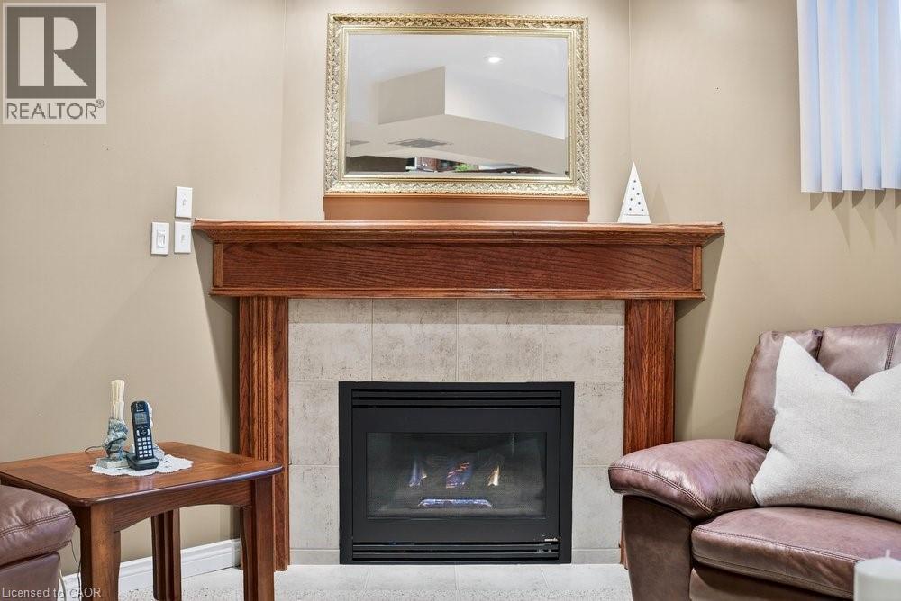128 Nugent Drive, Hamilton, ON - Indoor Photo Showing Living Room With Fireplace