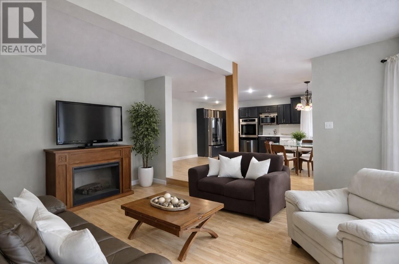 26 Main Road, Hare Bay, NL - Indoor Photo Showing Living Room With Fireplace