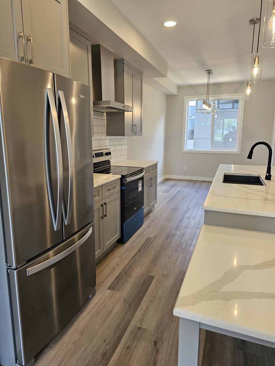 8069-8073 Cedric Mah Rd, Edmonton, AB - Indoor Photo Showing Kitchen With Stainless Steel Kitchen With Upgraded Kitchen