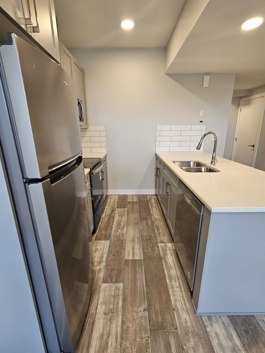8069-8073 Cedric Mah Rd, Edmonton, AB - Indoor Photo Showing Kitchen With Double Sink