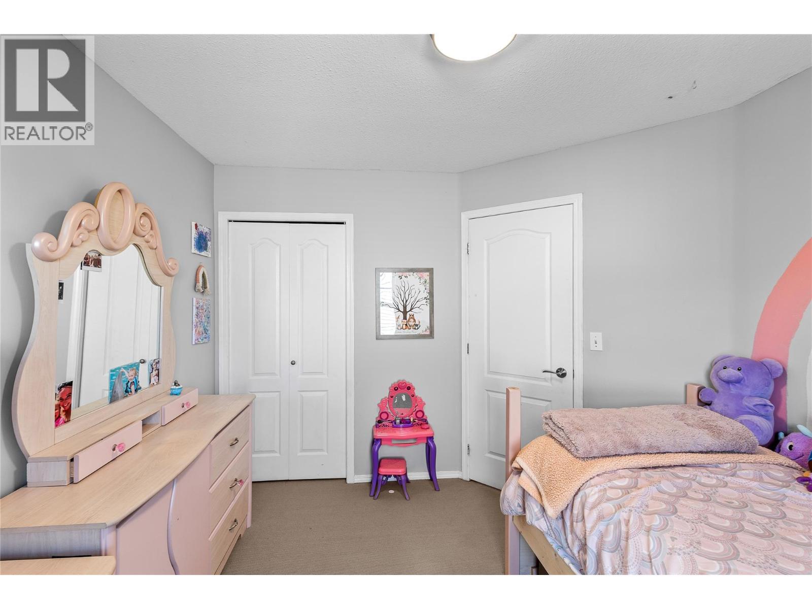 2395 Pleasant Valley Road Unit# 14, Armstrong, BC - Indoor Photo Showing Bedroom