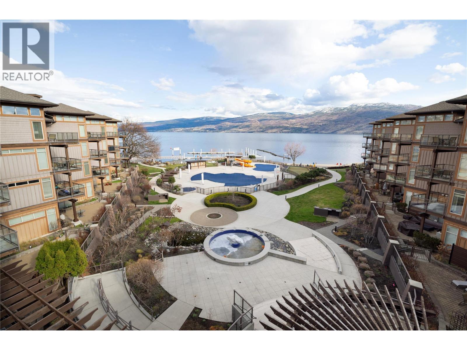 Views from your private patio overlooking pools and the lake. - 4205 Gellatly Road Unit# 416, West Kelowna, BC - Outdoor With Body Of Water With View