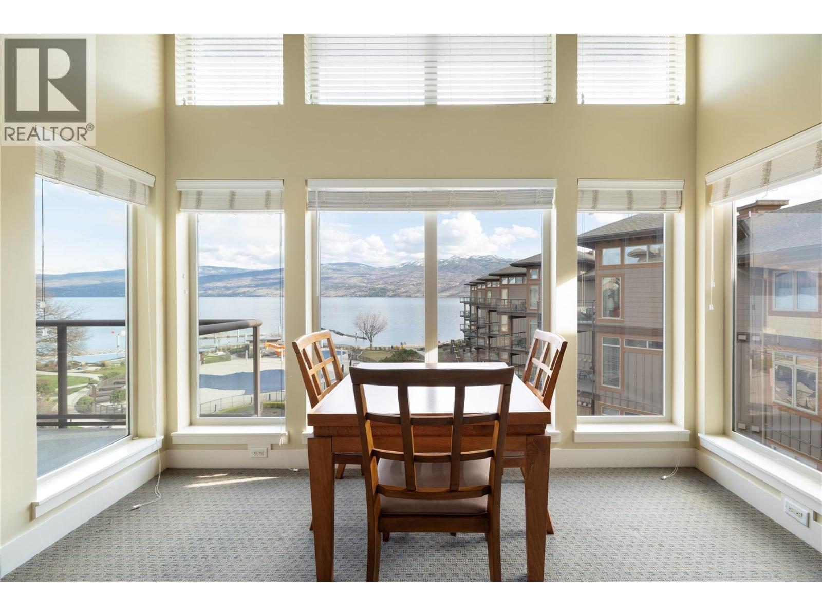 Amazing light for the main living space with views overlooking the lake and pools. - 4205 Gellatly Road Unit# 416, West Kelowna, BC - Indoor Photo Showing Dining Room
