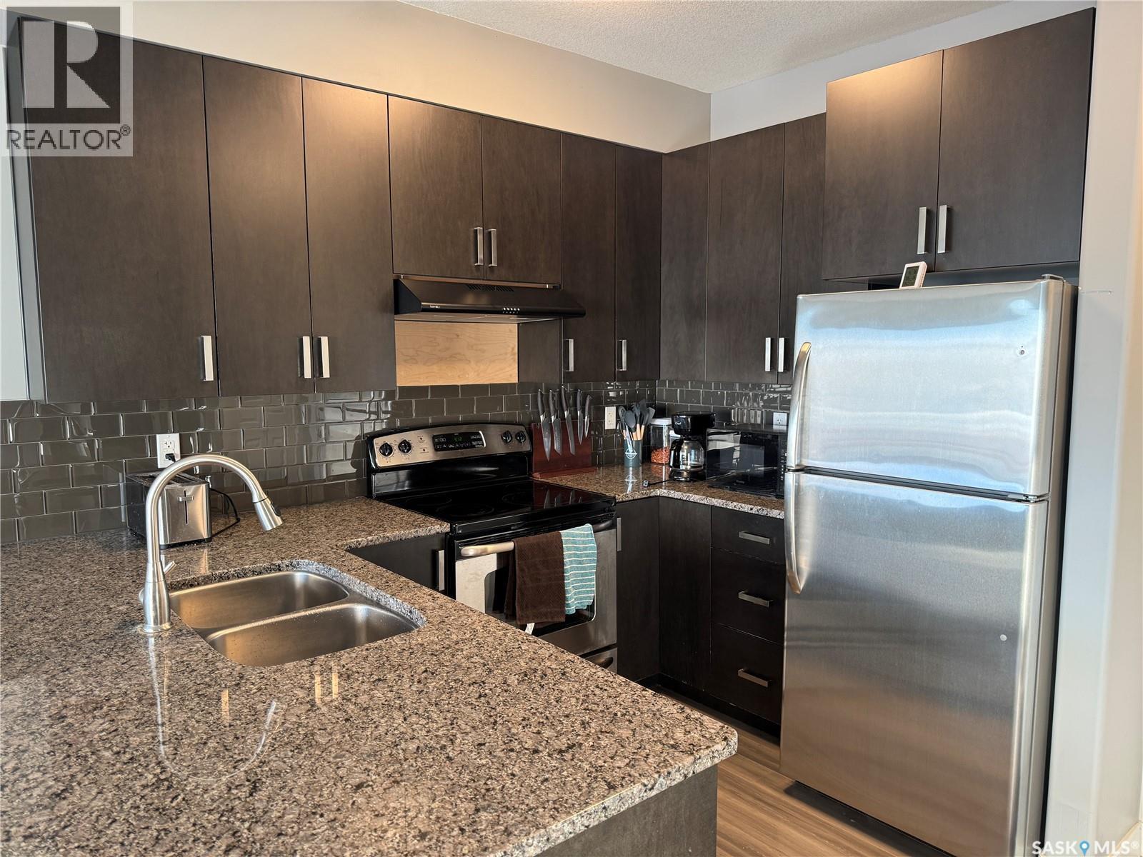 121 158 Pawlychenko Lane, Saskatoon, SK - Indoor Photo Showing Kitchen With Double Sink With Upgraded Kitchen