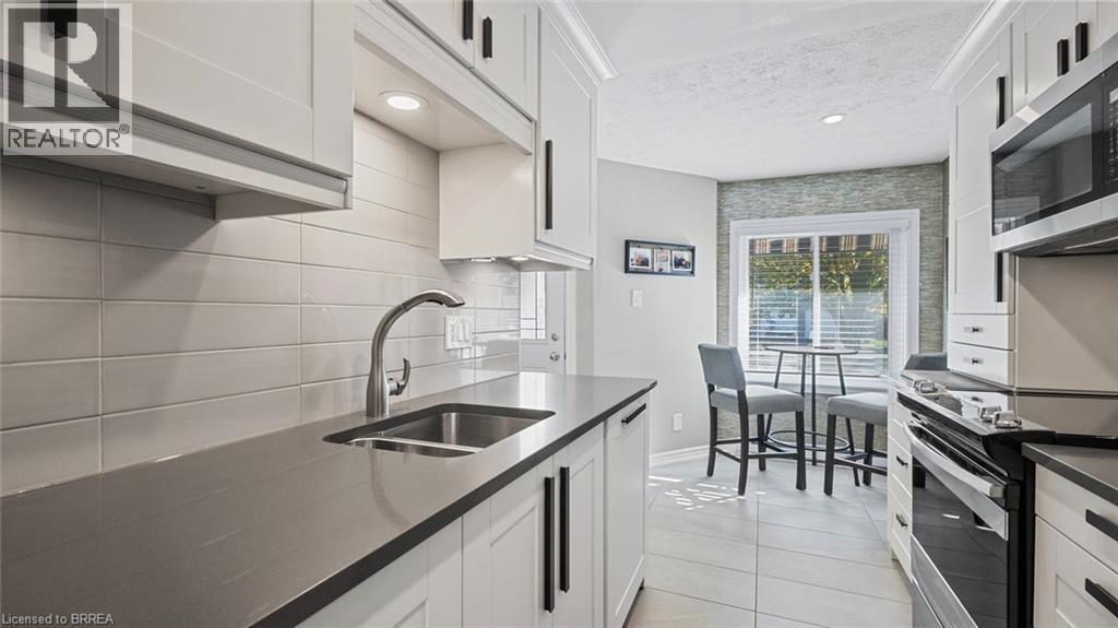 23 Freeman Crescent, Simcoe, ON - Indoor Photo Showing Kitchen With Double Sink With Upgraded Kitchen