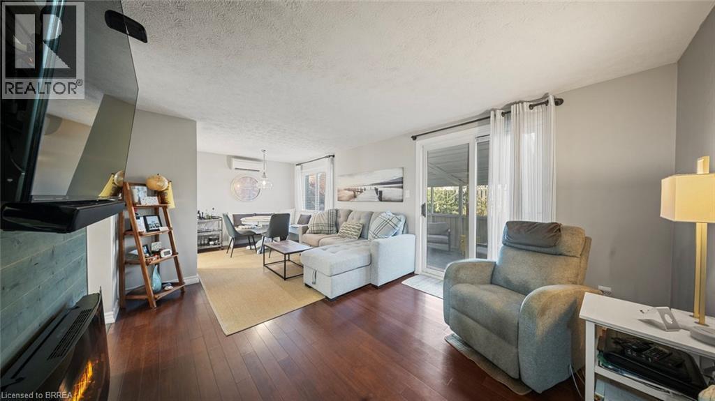 23 Freeman Crescent, Simcoe, ON - Indoor Photo Showing Living Room With Fireplace