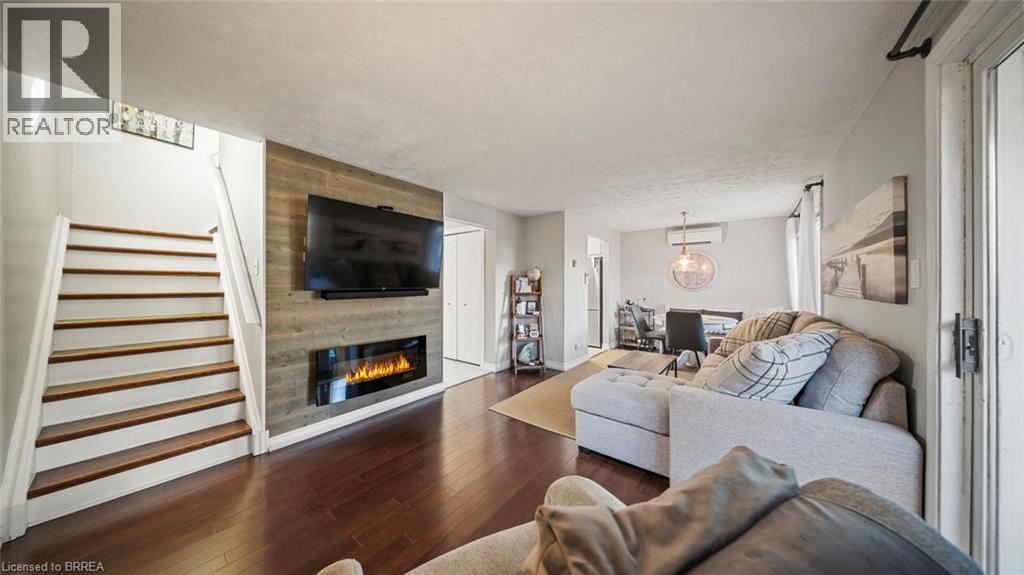 23 Freeman Crescent, Simcoe, ON - Indoor Photo Showing Living Room With Fireplace