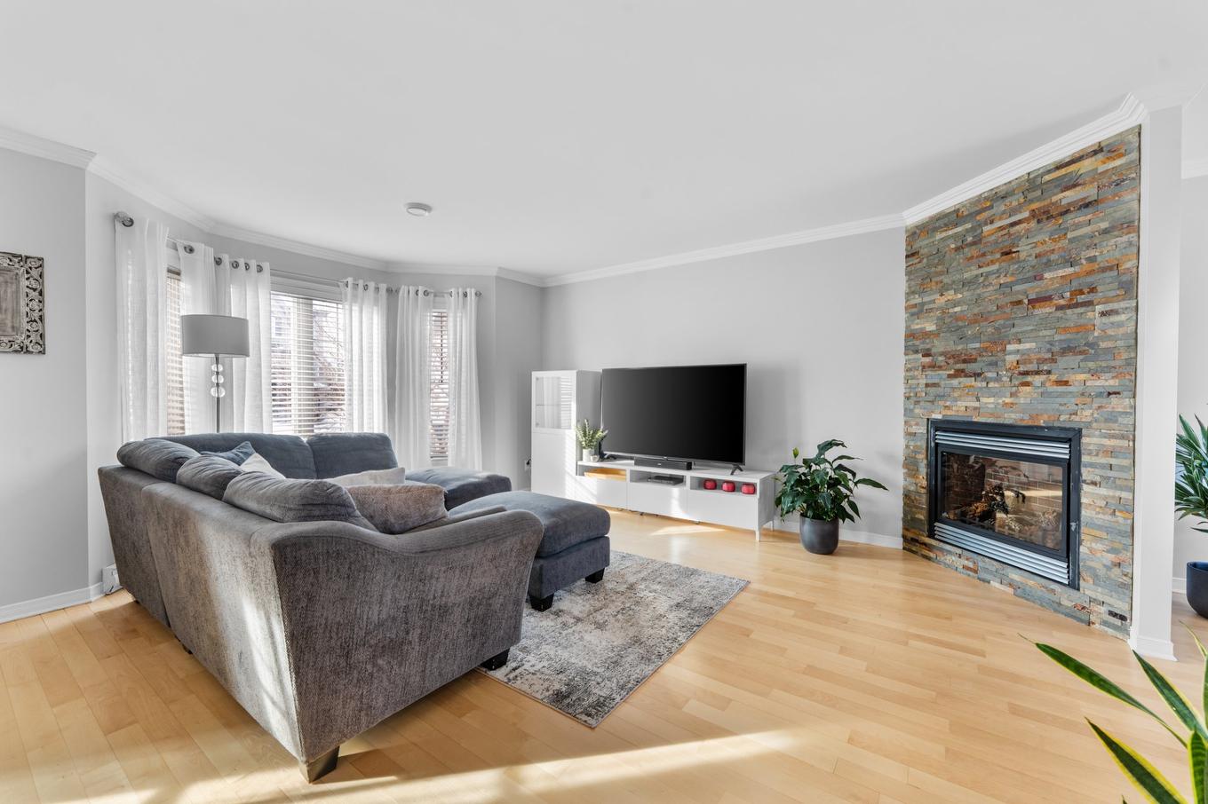 Living room - 723 Av. Du Terroir, Terrebonne (Lachenaie), QC - Indoor Photo Showing Living Room With Fireplace