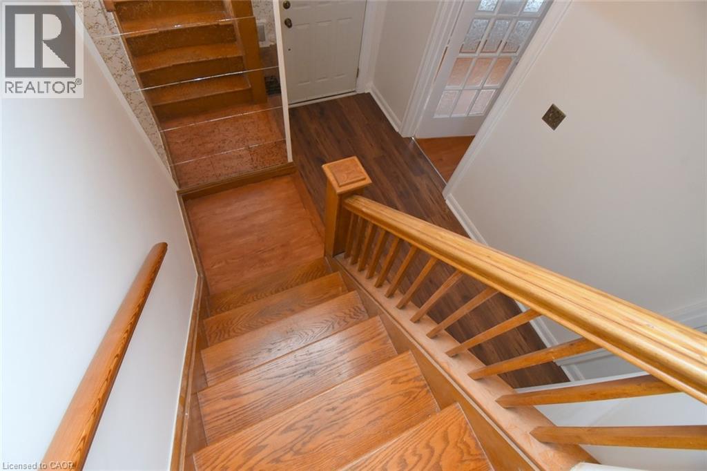 Staircase with wood finished floors - 136 Glen Road, Hamilton, ON - Indoor Photo Showing Other Room