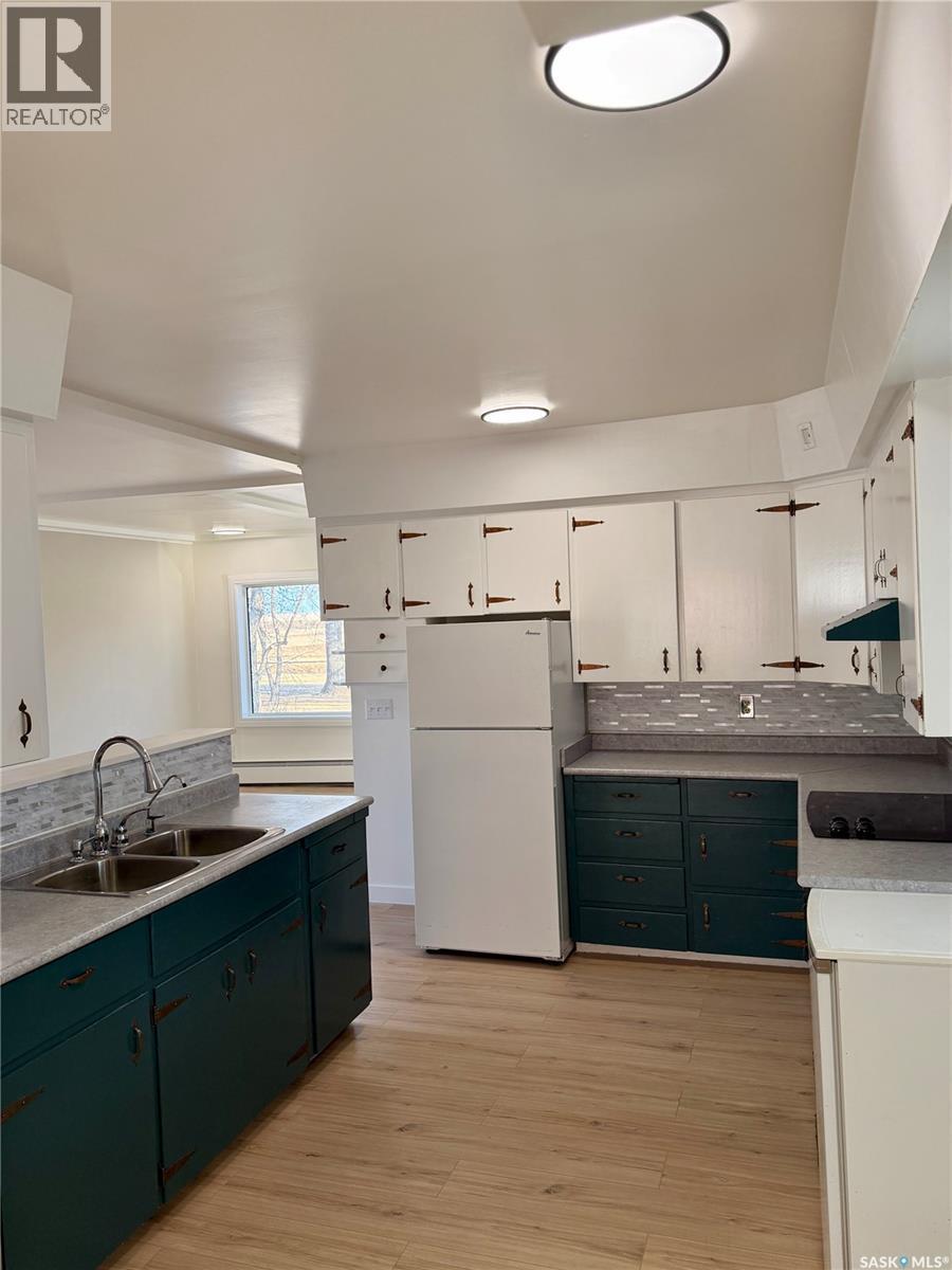133 Railway Avenue, Ponteix, SK - Indoor Photo Showing Kitchen With Double Sink