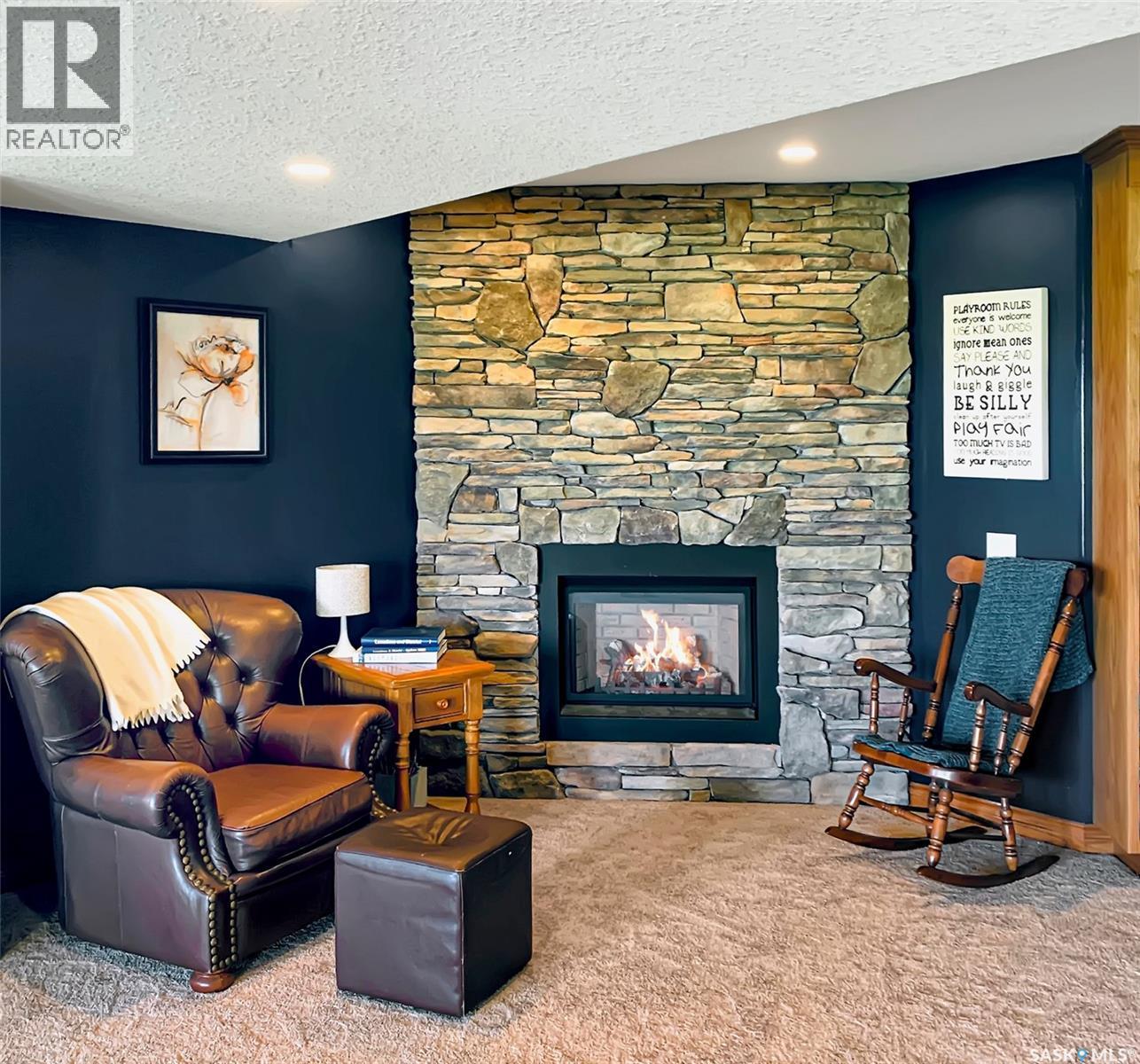 The Landing Acreage, Saskatchewan Landing, SK - Indoor Photo Showing Living Room With Fireplace