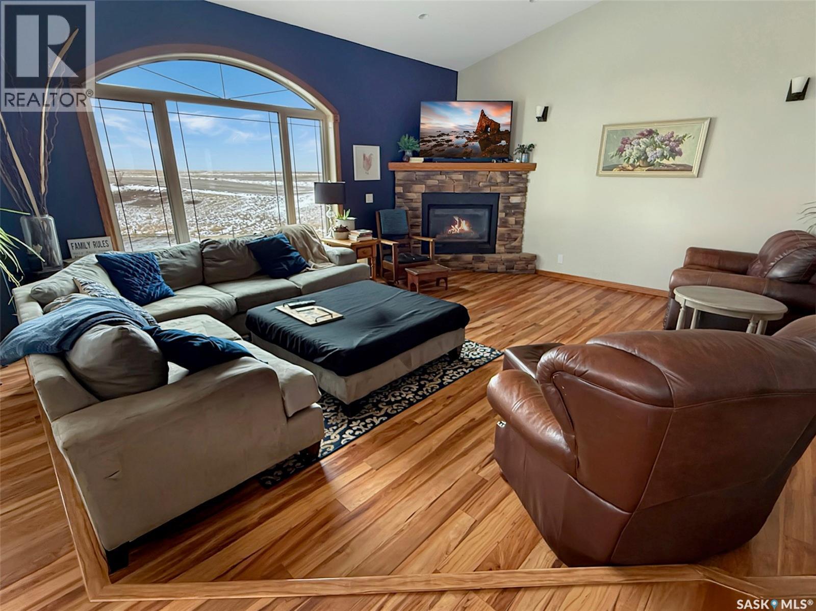The Landing Acreage, Saskatchewan Landing, SK - Indoor Photo Showing Living Room With Fireplace