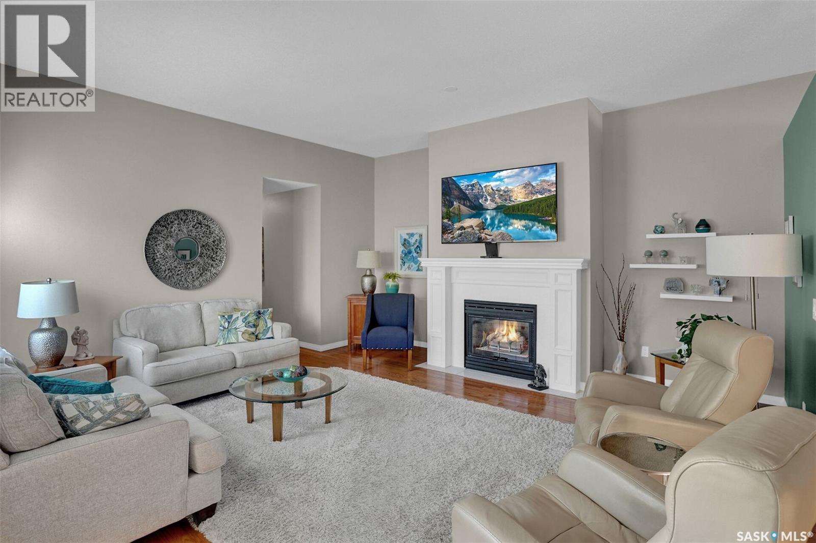72 Kensington Crescent, Regina, SK - Indoor Photo Showing Living Room With Fireplace