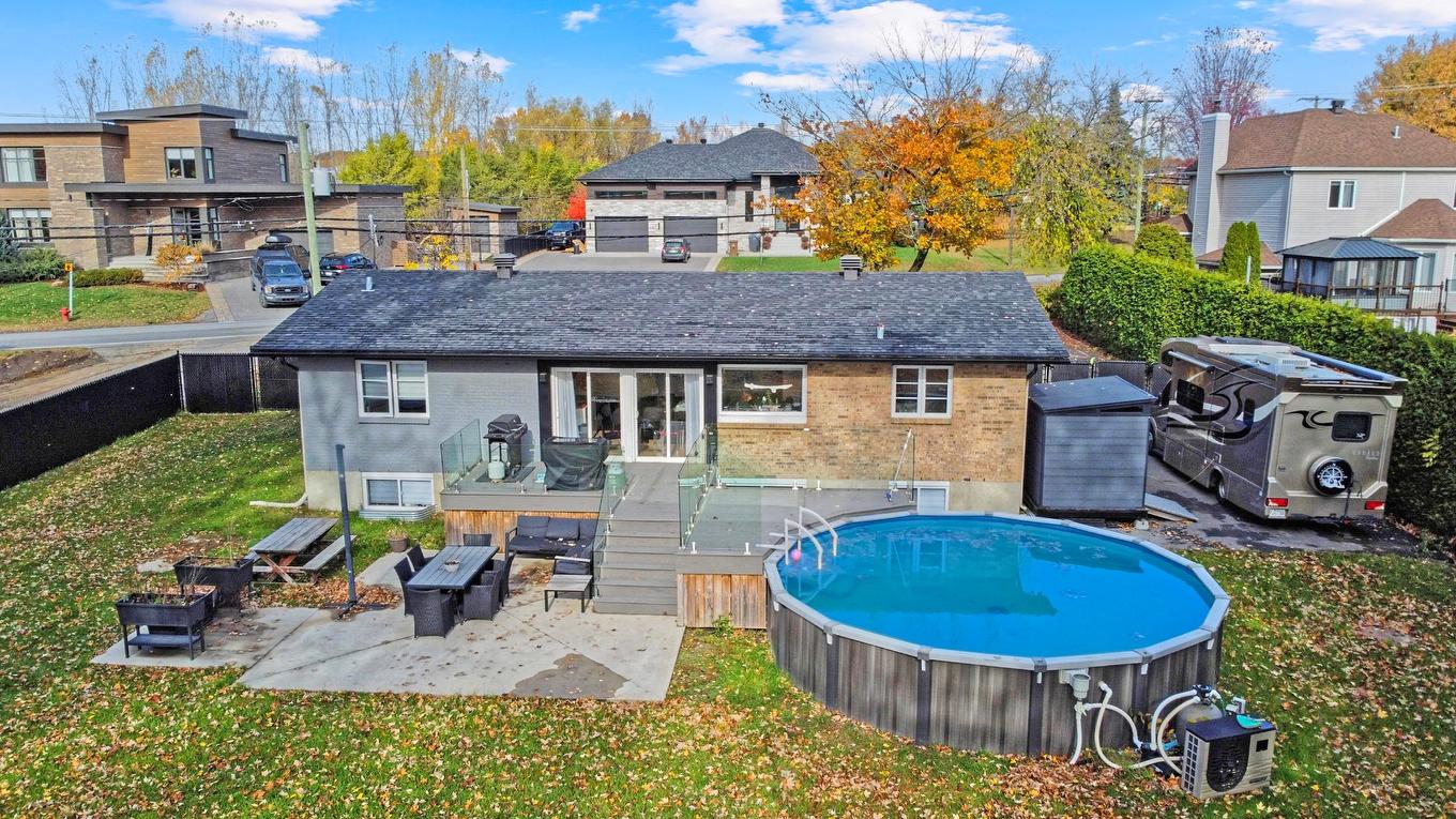 Pool - 1010 Côte De Terrebonne, Terrebonne (Terrebonne), QC - Outdoor With Above Ground Pool