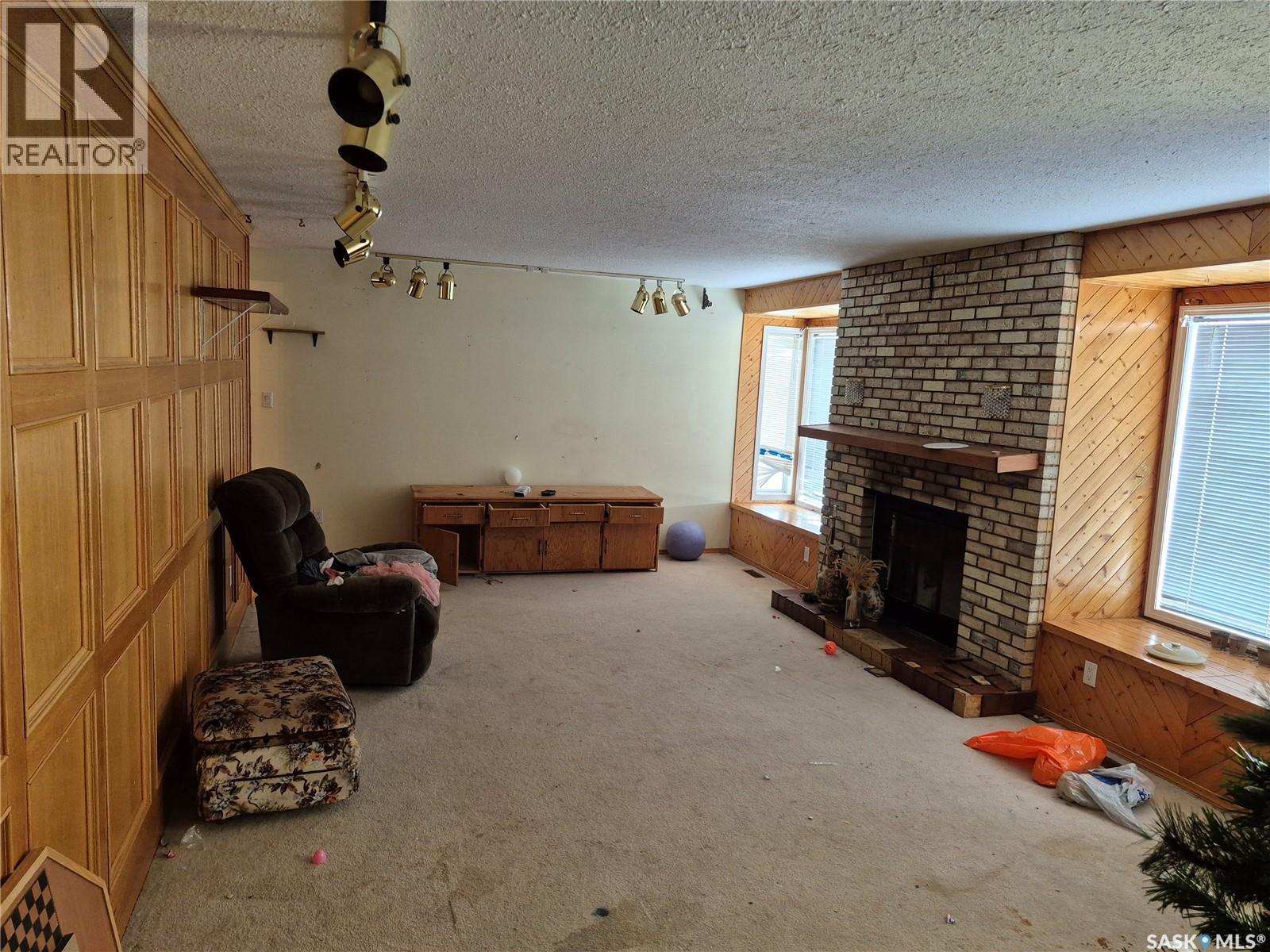 205 Railway Avenue N, Marcelin, SK - Indoor With Fireplace