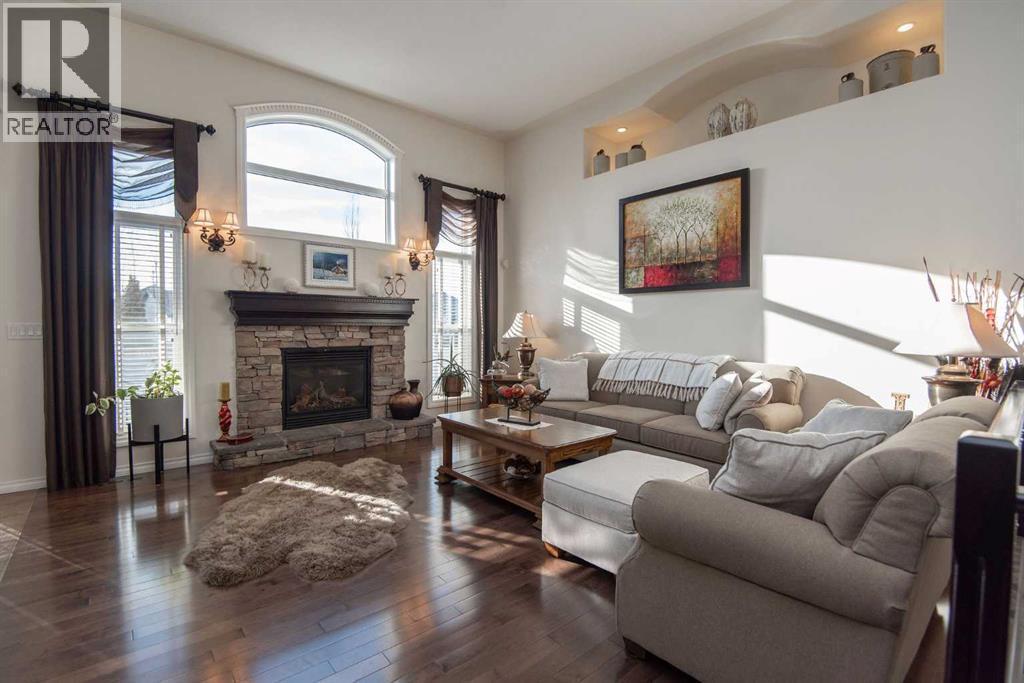 15 Volk Place, Red Deer, AB - Indoor Photo Showing Living Room With Fireplace
