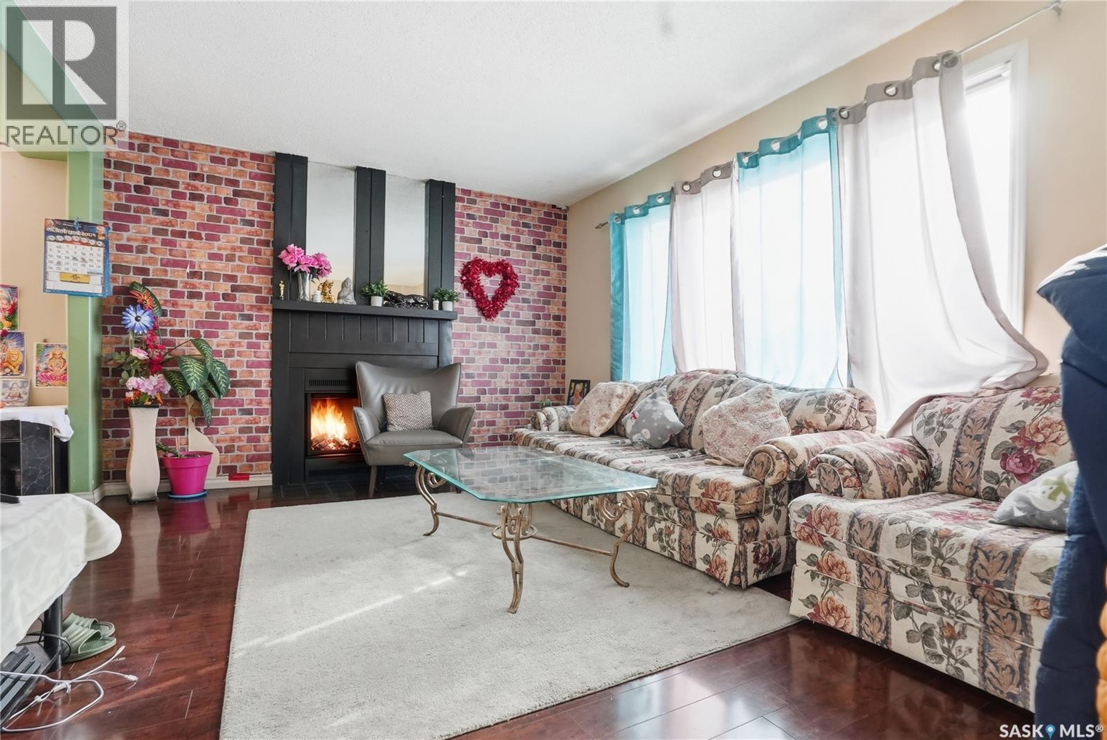 3523 Taylor Street E, Saskatoon, SK - Indoor Photo Showing Living Room With Fireplace