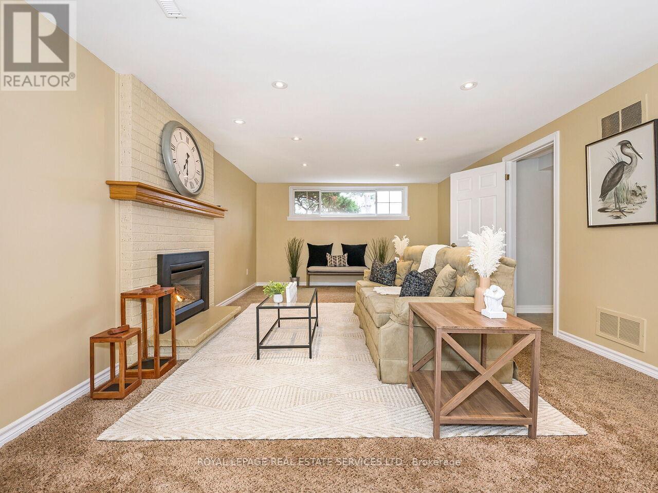 437 Highside Drive, Milton, ON - Indoor Photo Showing Living Room With Fireplace