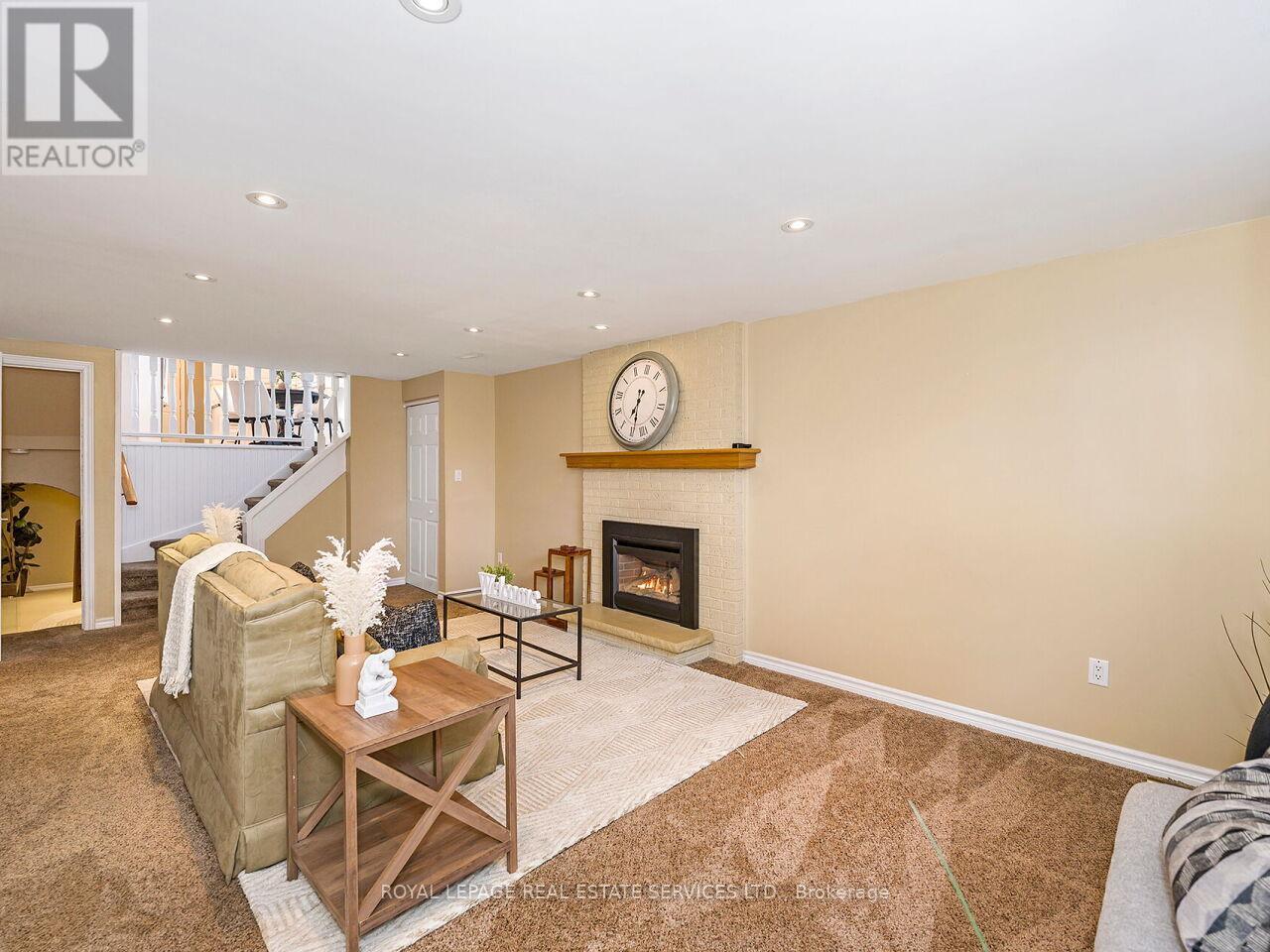 437 Highside Drive, Milton, ON - Indoor Photo Showing Living Room With Fireplace