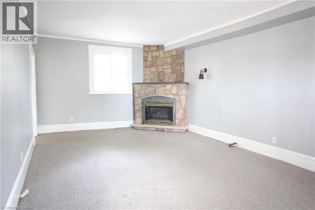 Living Room - 1076 King Road, Burlington, ON - Indoor Photo Showing Living Room With Fireplace