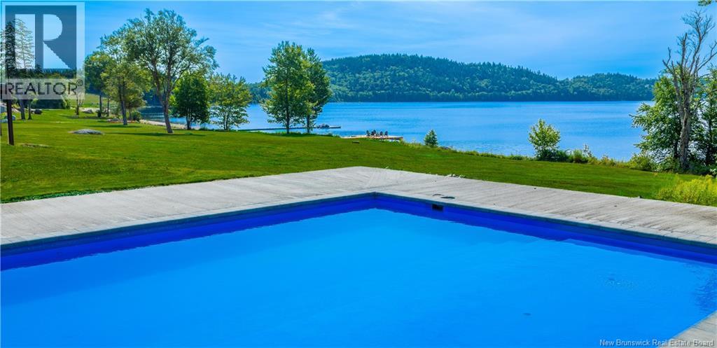 1191 Route 785 Unit# 88, Utopia, NB - Outdoor With Body Of Water With In Ground Pool