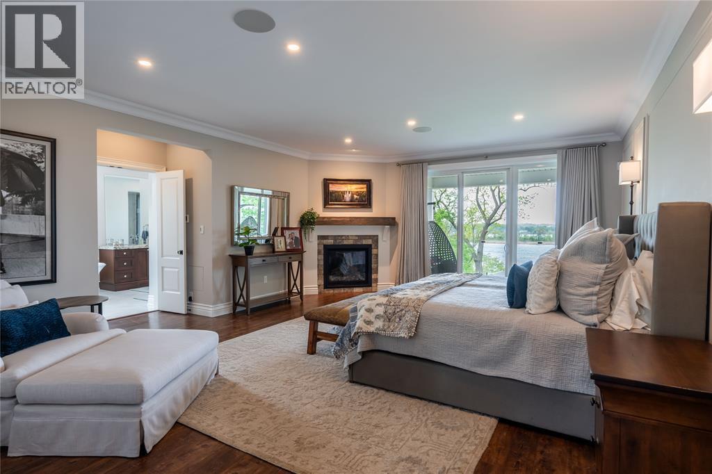 647 St Clair Parkway, St Clair, ON - Indoor Photo Showing Bedroom With Fireplace