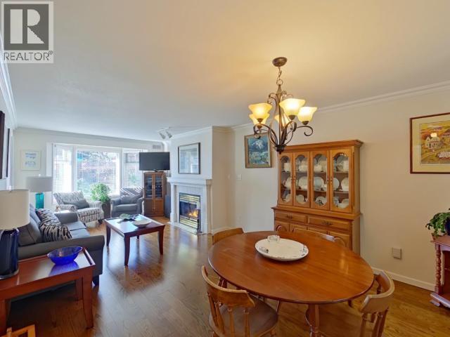 104-4685 Joyce Ave, Powell River, BC - Indoor Photo Showing Dining Room With Fireplace