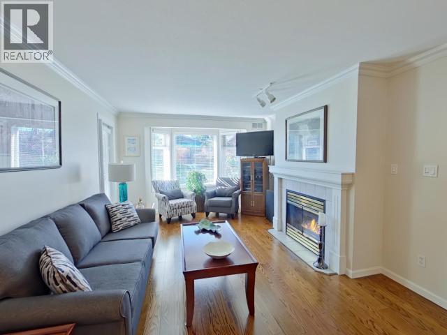 104-4685 Joyce Ave, Powell River, BC - Indoor Photo Showing Living Room With Fireplace