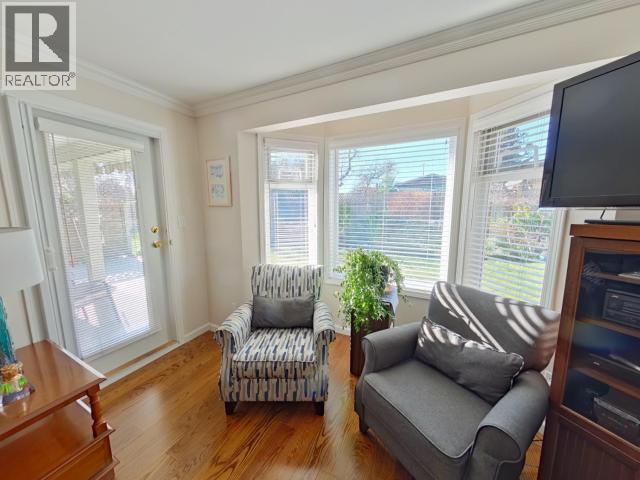 104-4685 Joyce Ave, Powell River, BC - Indoor Photo Showing Living Room With Fireplace