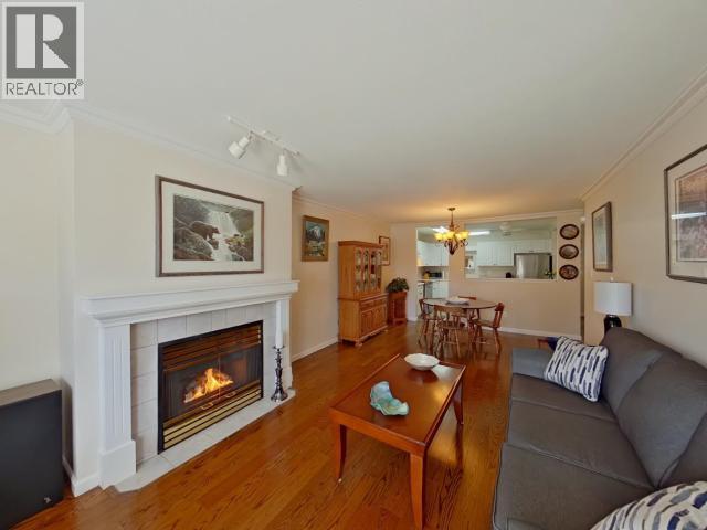 104-4685 Joyce Ave, Powell River, BC - Indoor Photo Showing Living Room With Fireplace