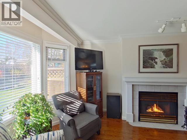 104-4685 Joyce Ave, Powell River, BC - Indoor Photo Showing Living Room With Fireplace