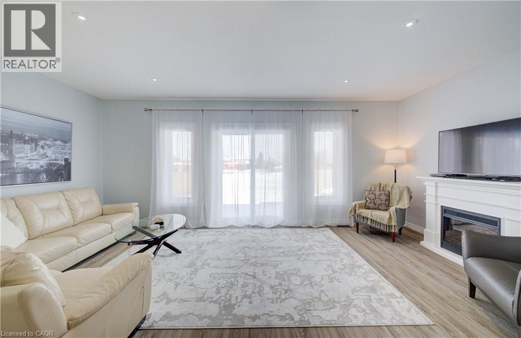 64 Hidden Creek Drive, Kitchener, ON - Indoor Photo Showing Living Room With Fireplace