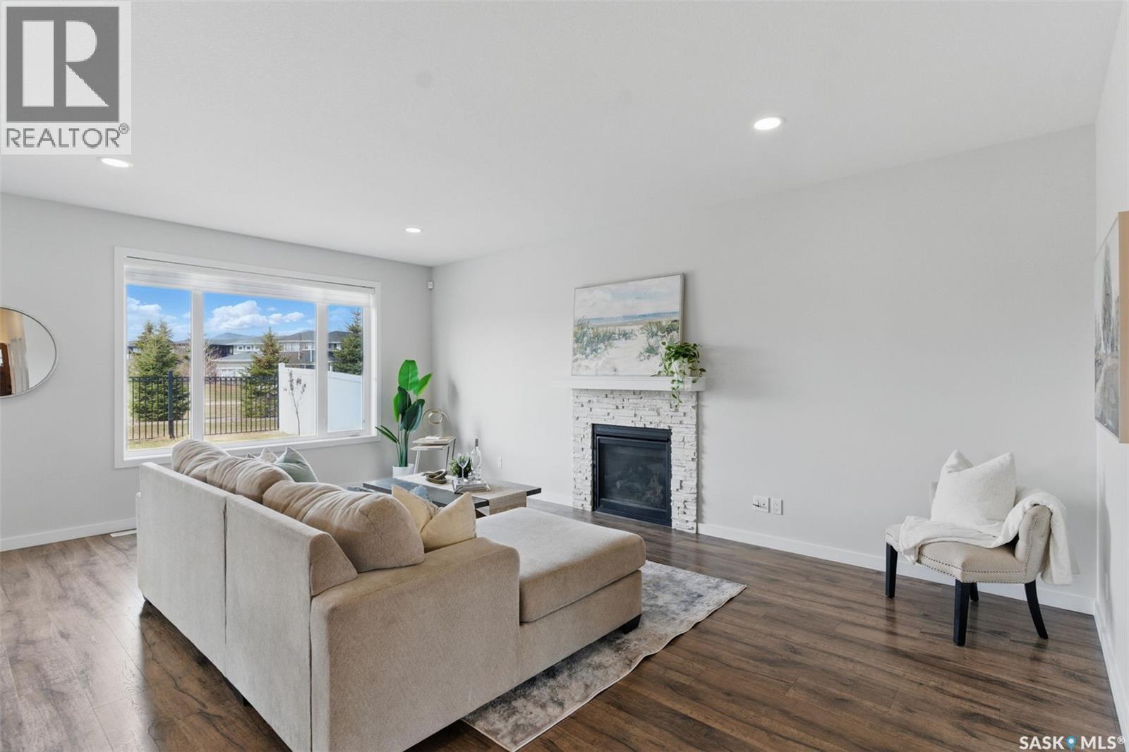 306 Secord Way, Saskatoon, SK - Indoor Photo Showing Living Room With Fireplace