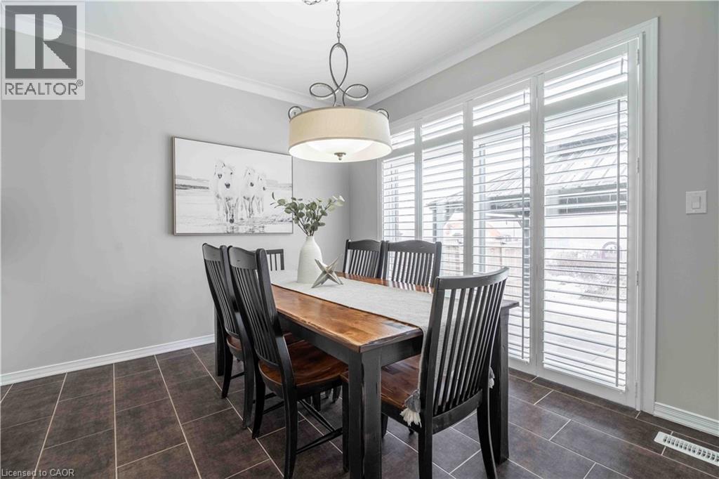 Inviting view of dining area facing the transomed patio doors to provide easy access to yard and view beyond. - 115 Larry Crescent, Caledonia, ON - Indoor Photo Showing Dining Room