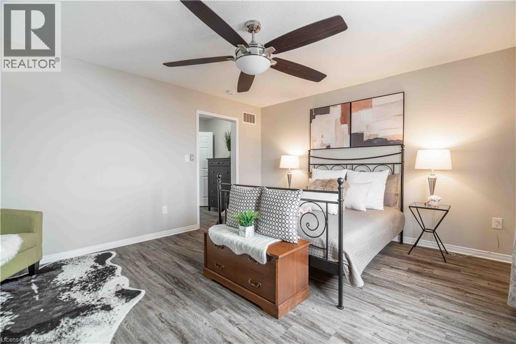 Primary bedroom with luxury vinyl laminate flooring. - 115 Larry Crescent, Caledonia, ON - Indoor