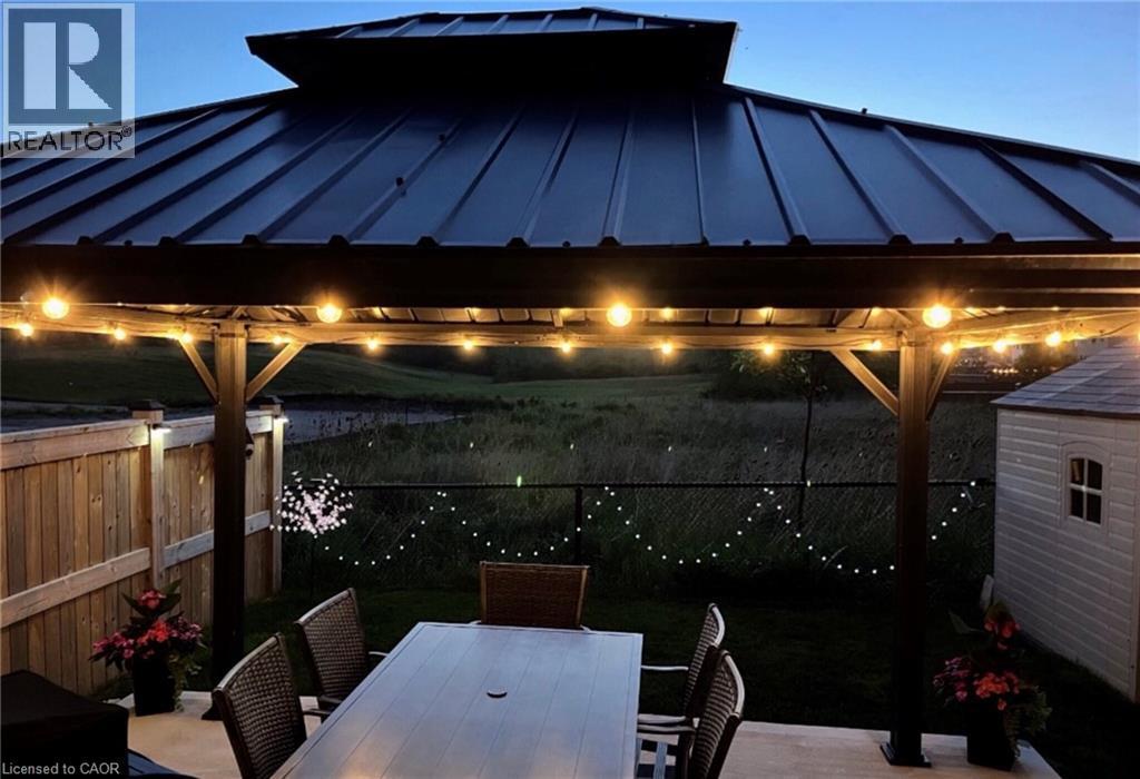Dramatic evening view of patio/gazebo facing the westerly setting sun. - 115 Larry Crescent, Caledonia, ON - Outdoor