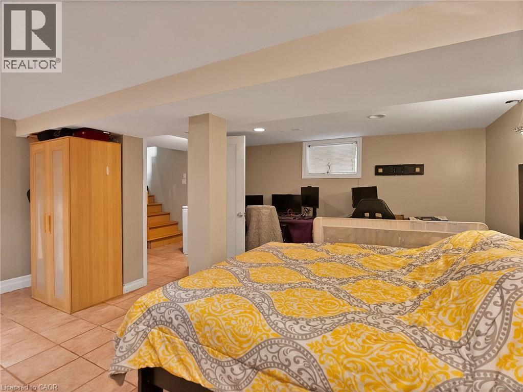 Bedroom featuring light tile patterned flooring and recessed lighting - 210 East 24Th Street, Hamilton, ON - Indoor Photo Showing Bedroom