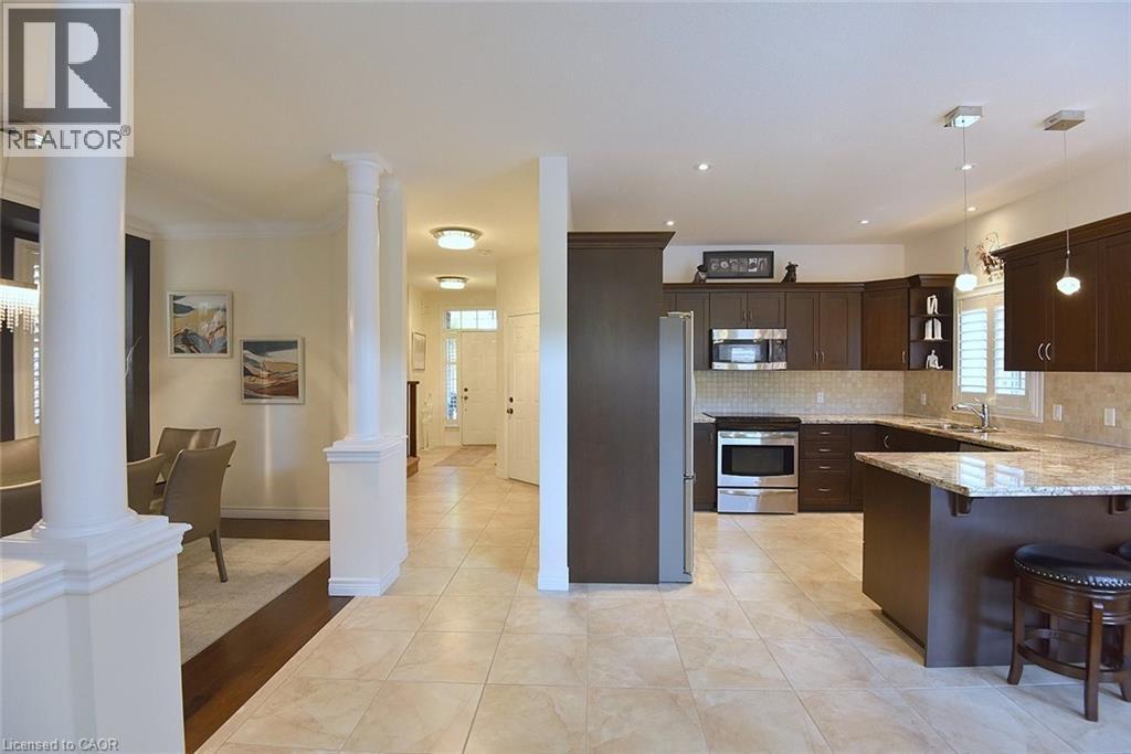 12 Degrow Crescent, Binbrook, ON - Indoor Photo Showing Kitchen With Stainless Steel Kitchen With Double Sink With Upgraded Kitchen