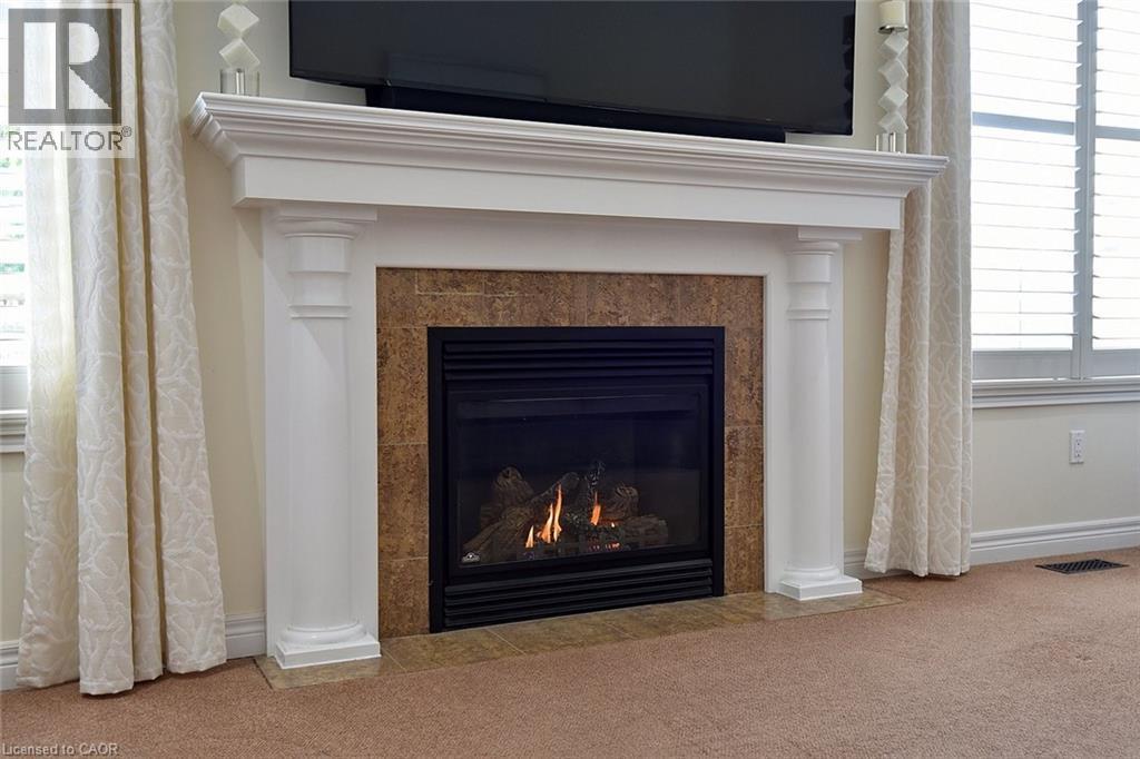 12 Degrow Crescent, Binbrook, ON - Indoor Photo Showing Living Room With Fireplace