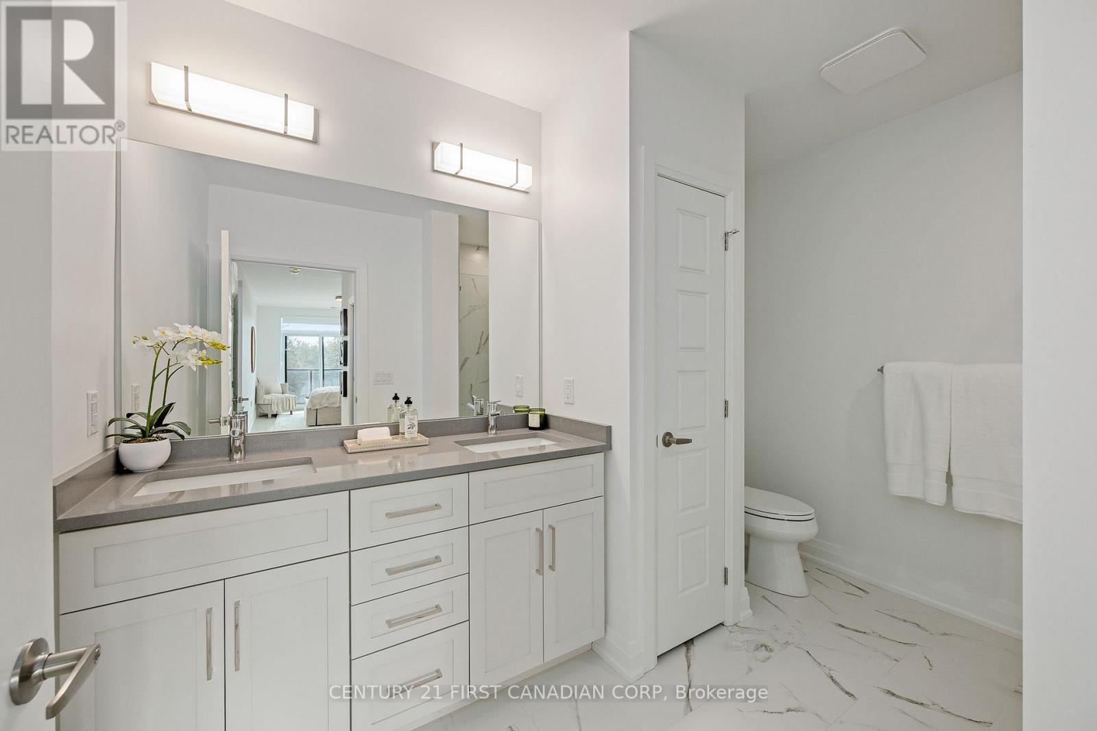 Ensuite with glass shower and double sinks - 308 - 1560 Upper West Avenue, London South (South B), ON - Indoor Photo Showing Bathroom