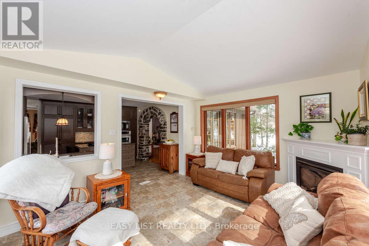 704 Pattee Road, Champlain, ON - Indoor Photo Showing Living Room With Fireplace