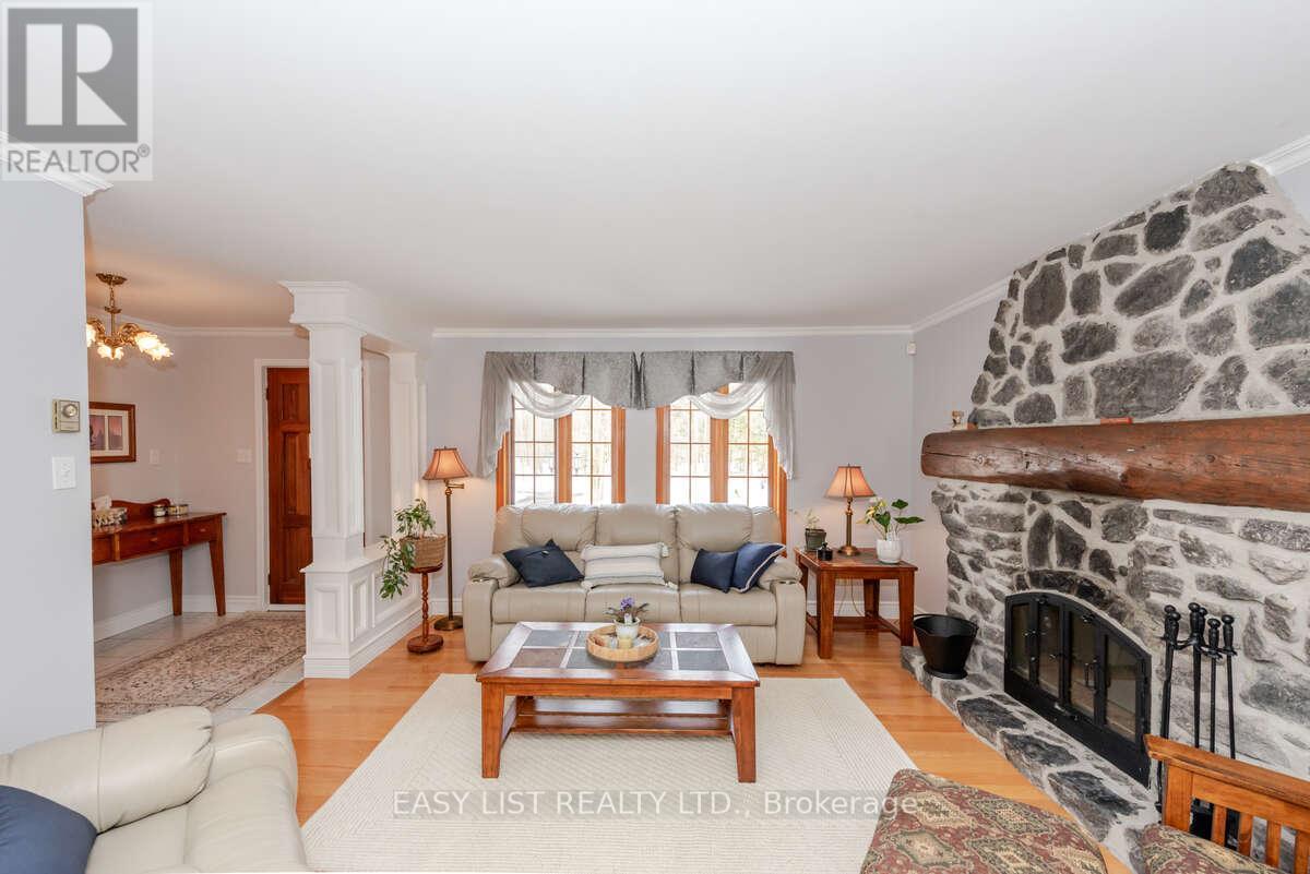 704 Pattee Road, Champlain, ON - Indoor Photo Showing Living Room With Fireplace