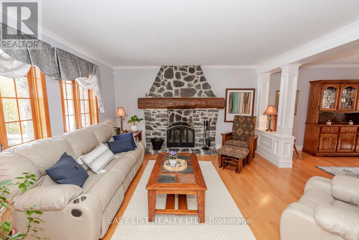 704 Pattee Road, Champlain, ON - Indoor Photo Showing Living Room With Fireplace